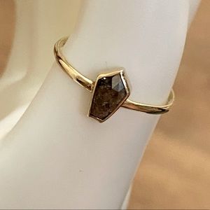 Diamond included coffin ring set in solid gold.